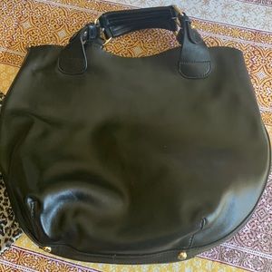 Danier black leather bag, inner lining bag and anthro guitar style purse strap.